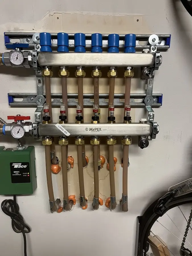 Plumber performing Water Heater Repair at a residential property in Defiance