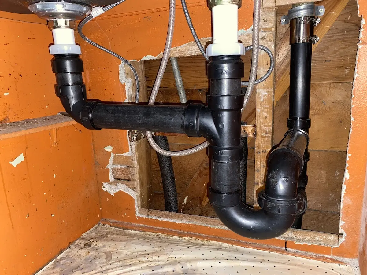 Professional Garbage Disposal Repair equipment and tools on the job in Defiance